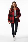 Red and black plaid jacket worn by a person on a white background