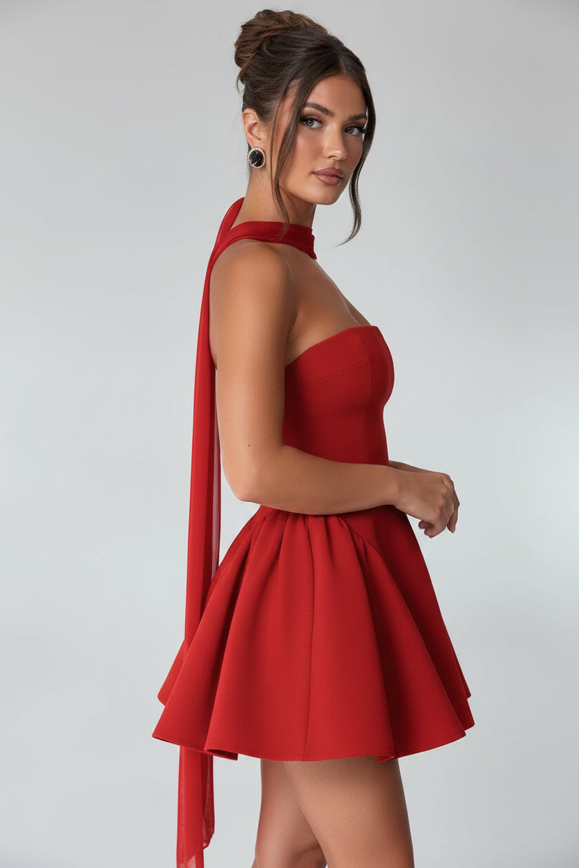 Red dress worn by a model on a light gray background