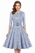 White dress with blue floral pattern on a white background