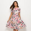Woman wearing a floral dress on a white background