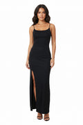 Black slip dress with a slit on a white background