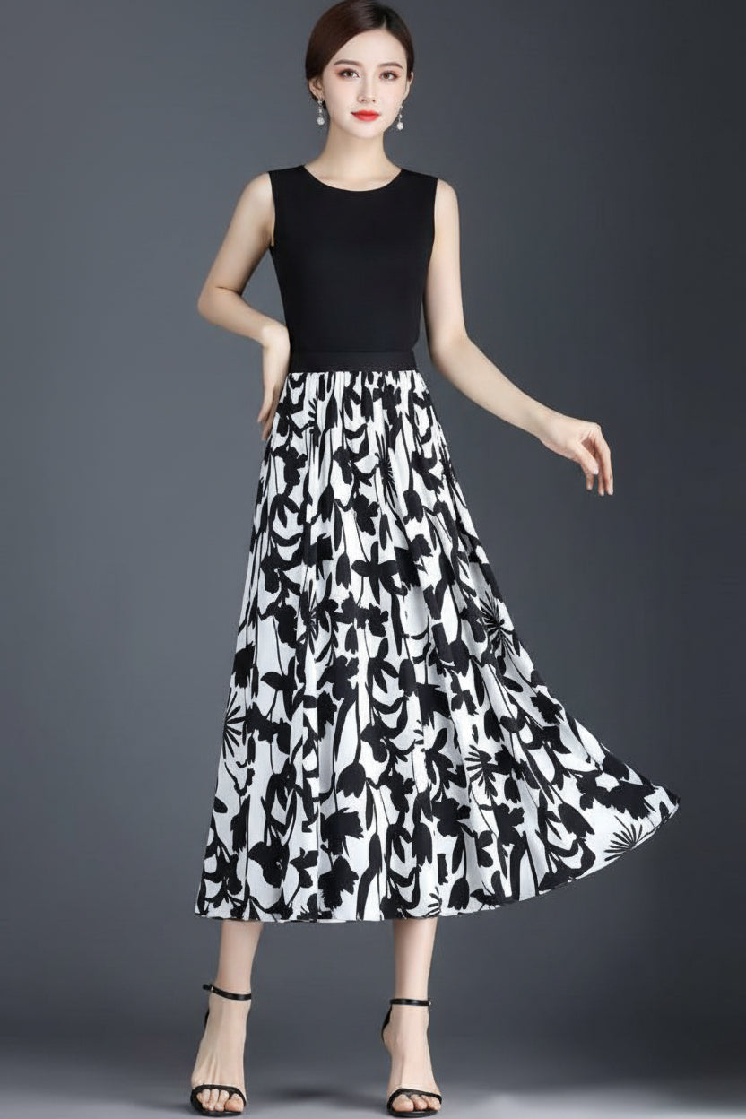 Woman wearing a black and white floral patterned skirt on a gray background