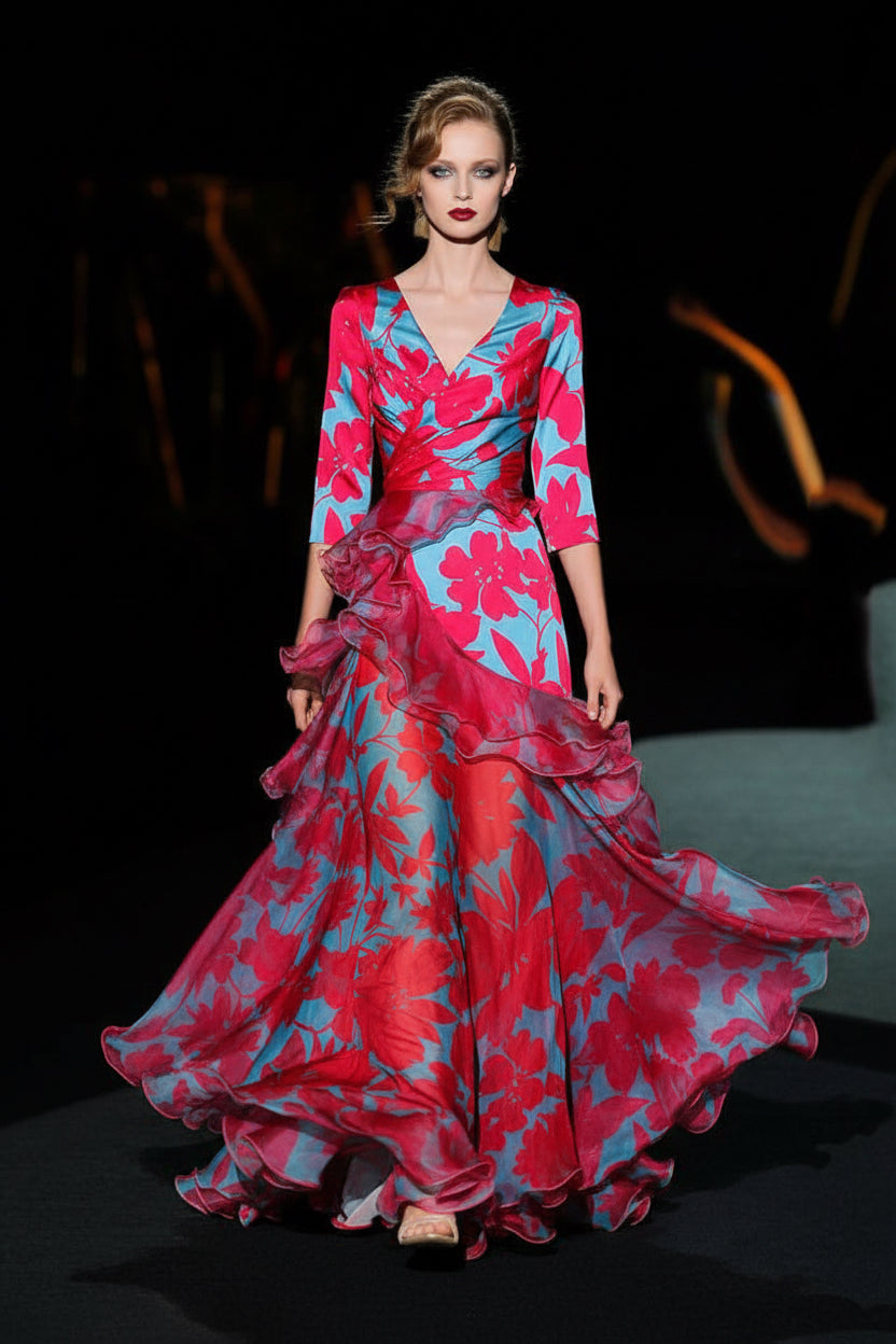 Woman wearing a vibrant floral dress on a dark background