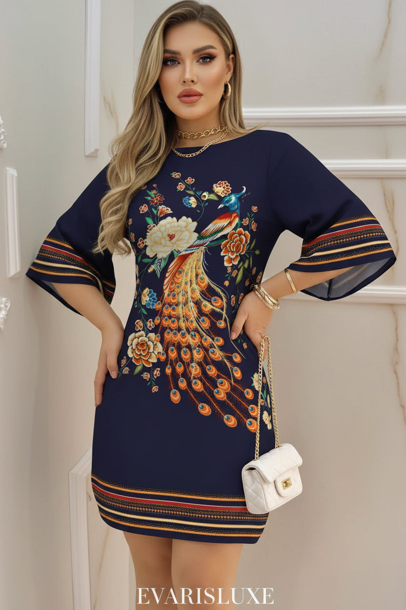 Navy blue dress with peacock and floral embroidery held by a person.