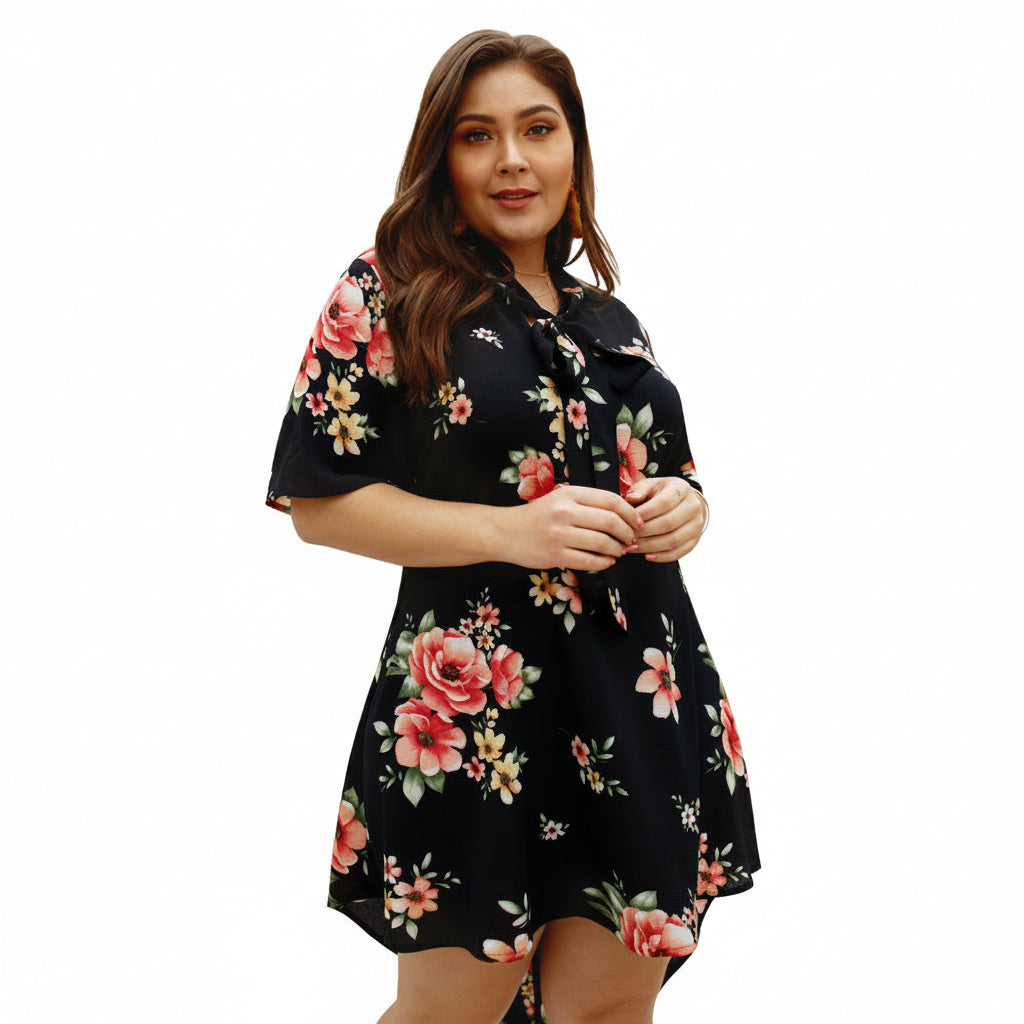 Woman wearing a black floral dress on a white background