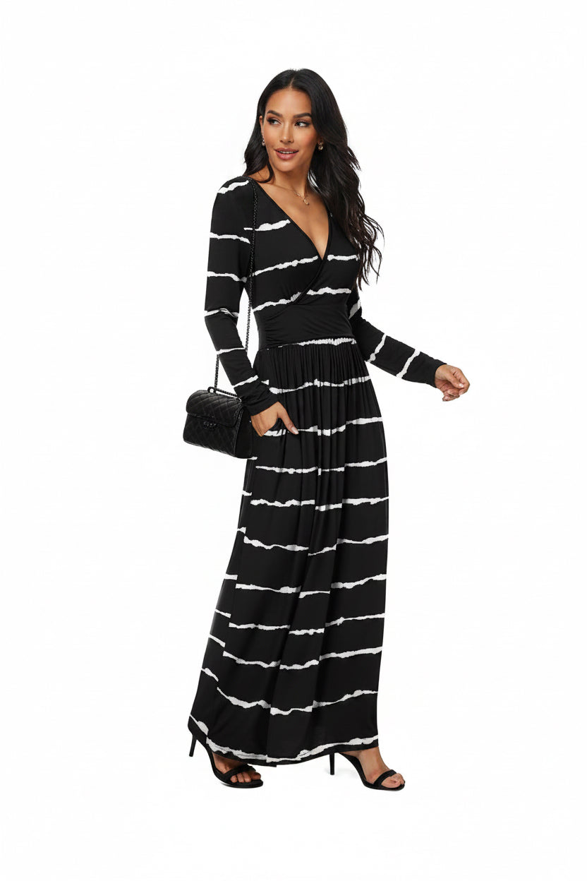 Woman wearing a black and white striped dress on a white background