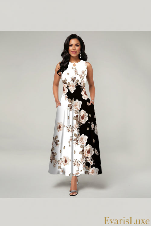 Woman wearing a floral dress with a black and white pattern on a gray background