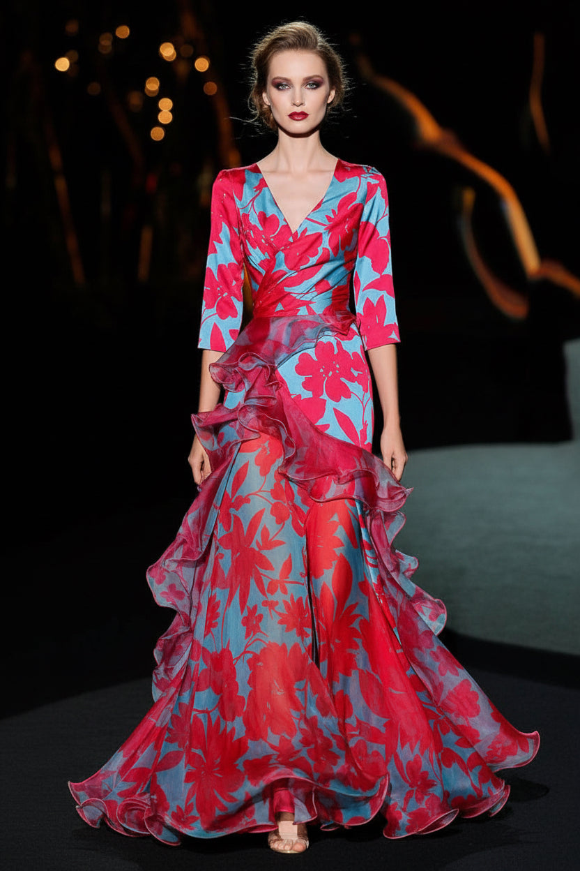 Woman wearing a vibrant floral dress on a dark background