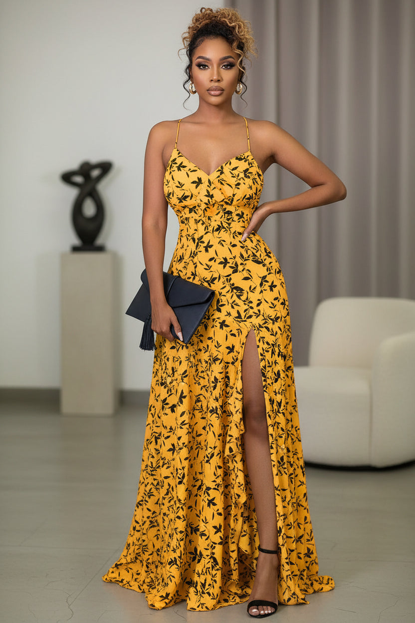 Woman in a yellow floral dress with a black clutch in an indoor setting