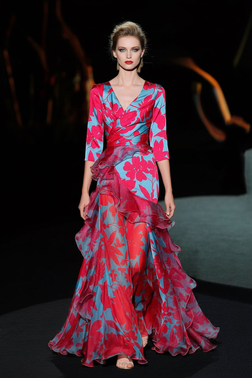 Woman wearing a vibrant floral dress on a dark background