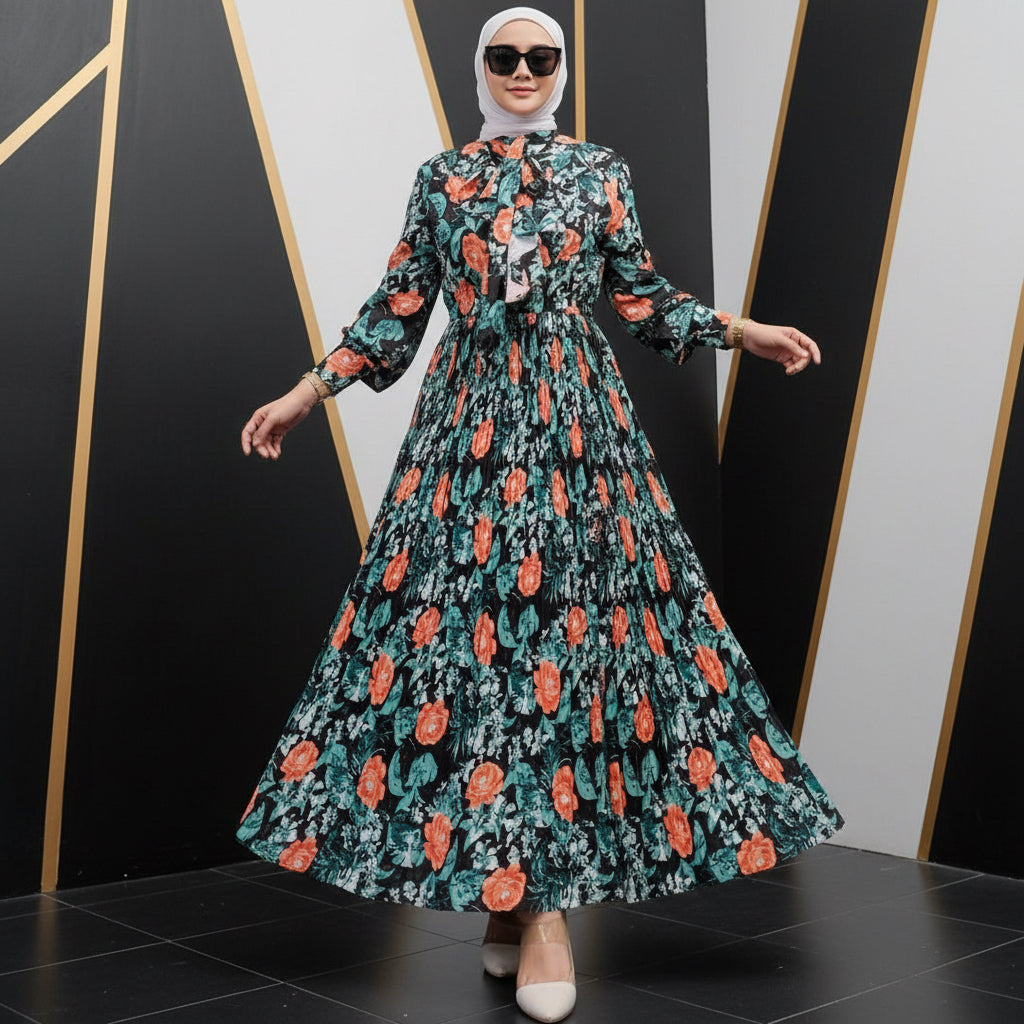 Woman wearing a floral dress with long sleeves and orange flowers, standing next to a close-up of the dress on a wooden surface.
