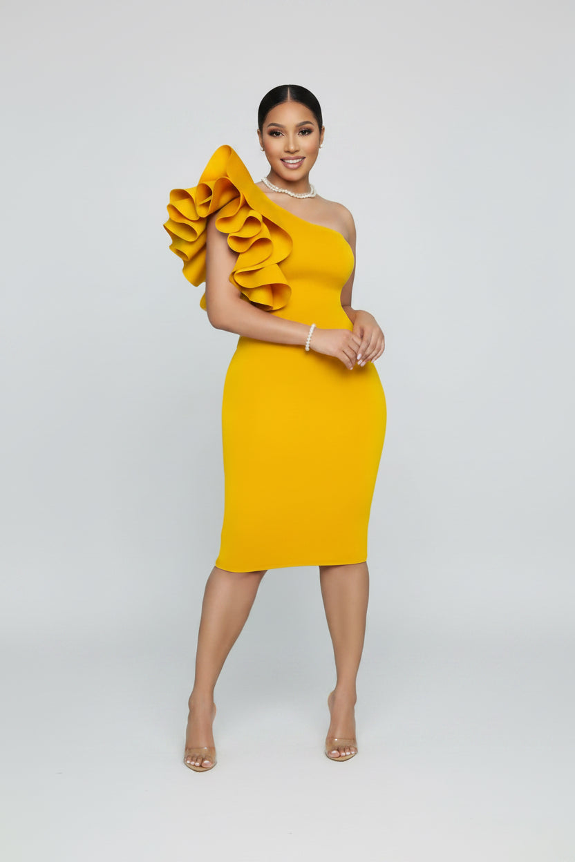 Yellow one-shoulder dress with ruffled detail on a white background