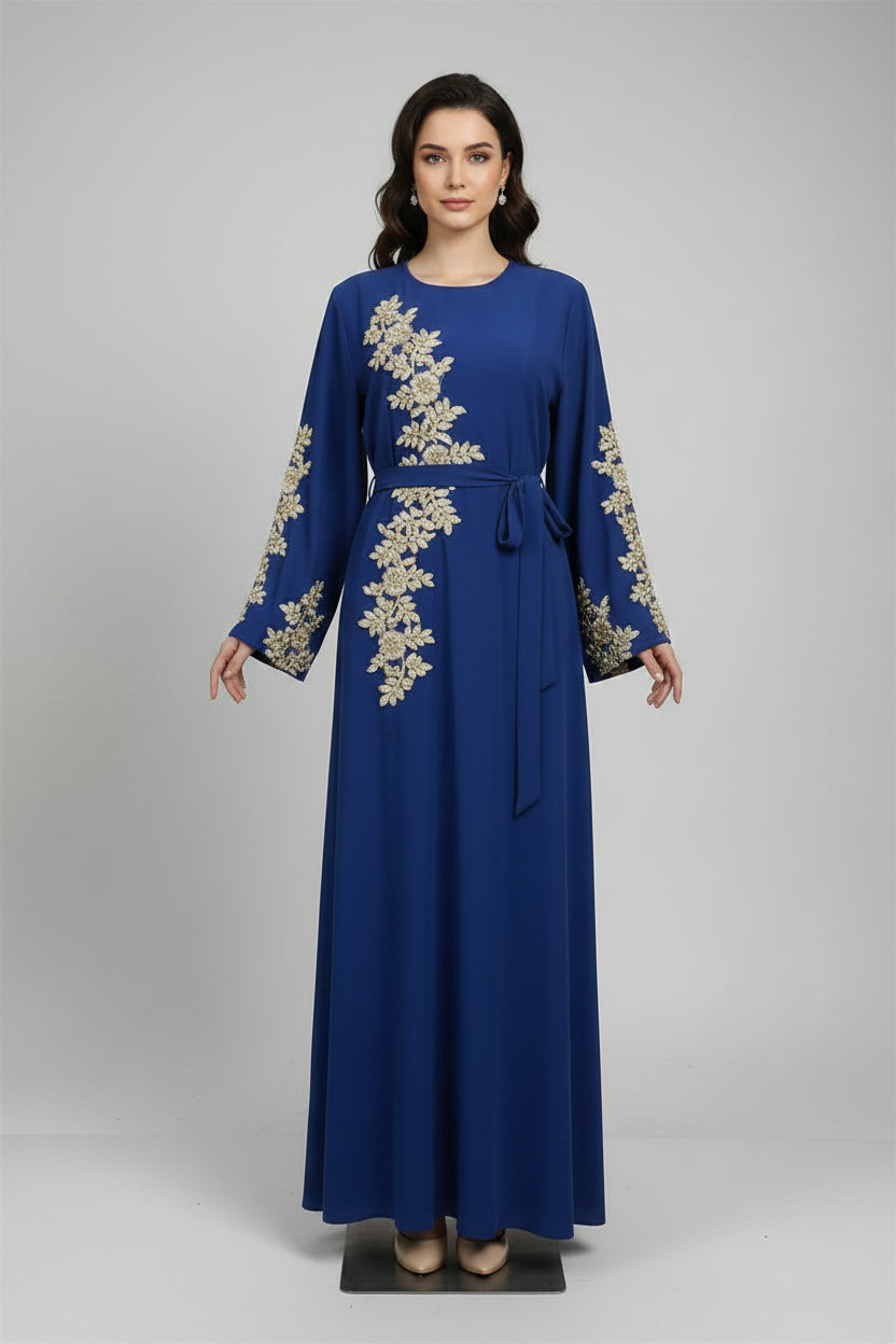 Blue dress with gold embroidery on a white background