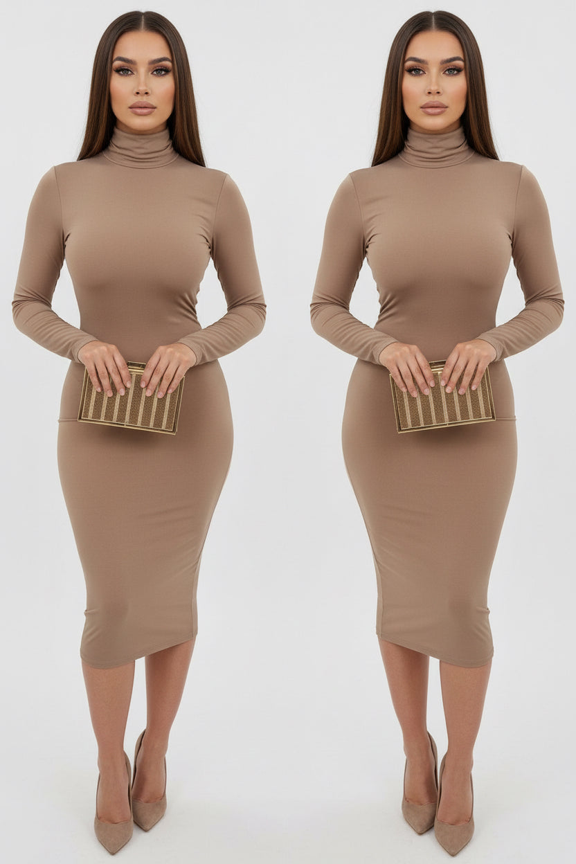 Person wearing a beige dress holding a clutch in front of a white wall.