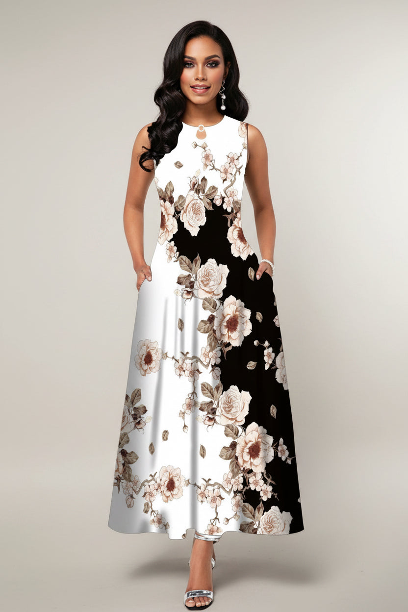 Woman wearing a floral dress with a black and white pattern on a gray background