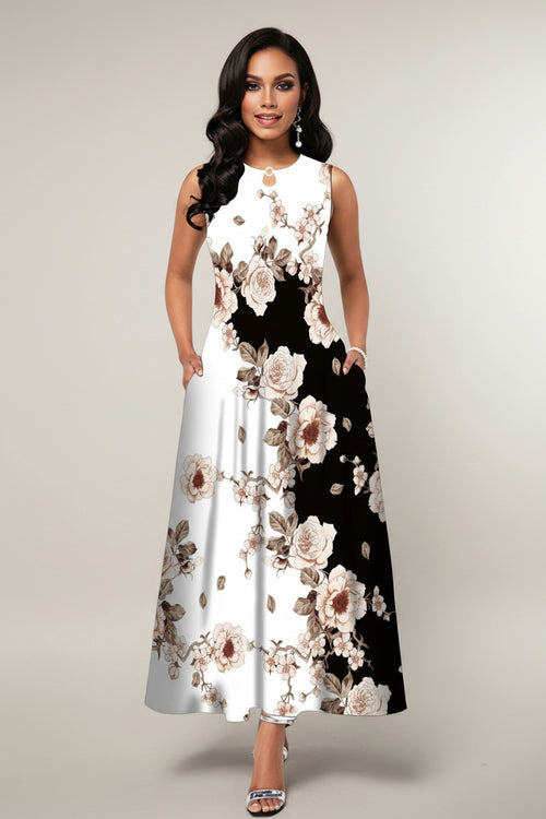 Woman wearing a floral dress with a black and white pattern on a gray background