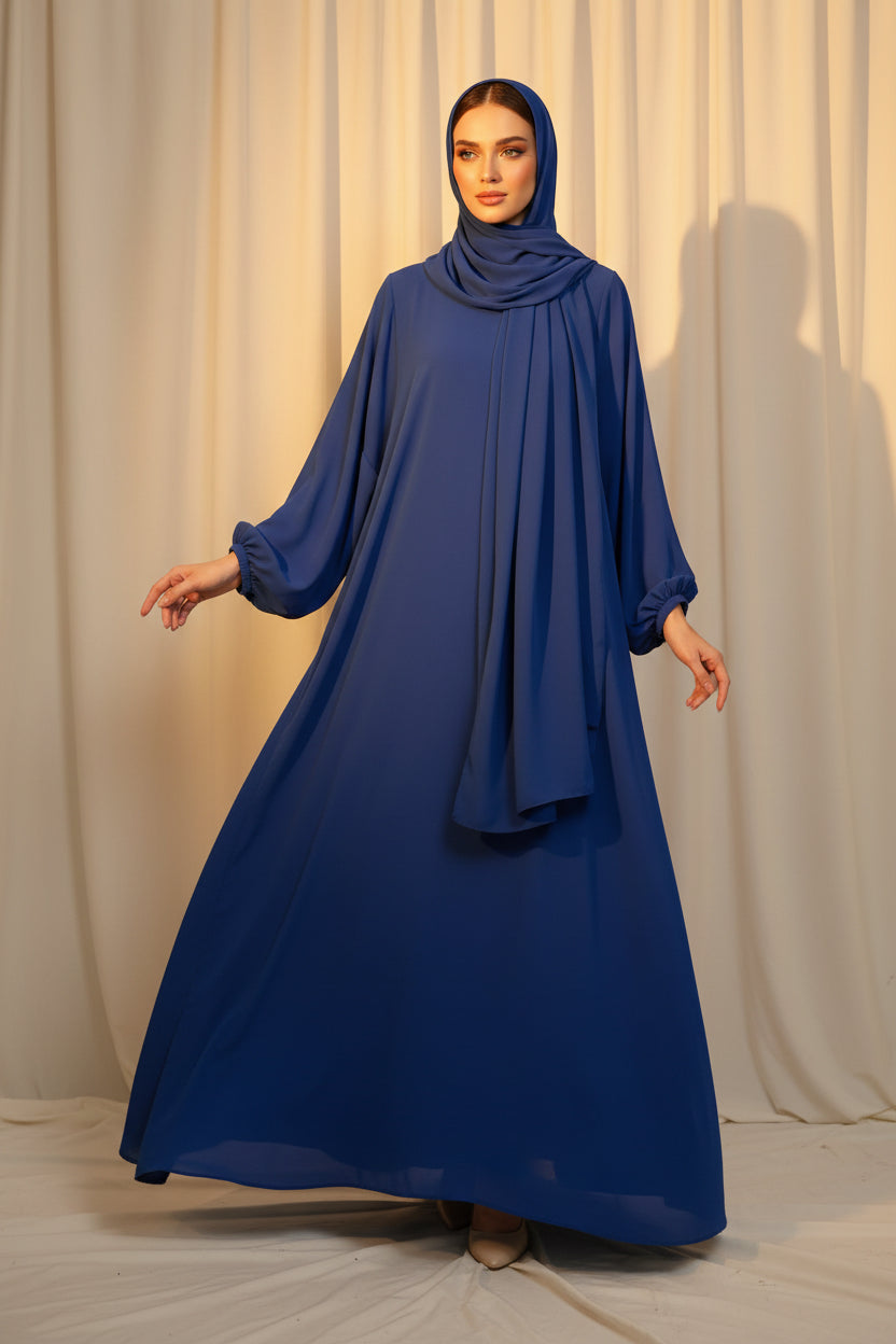 Blue dress hanging on a rack with a neutral background