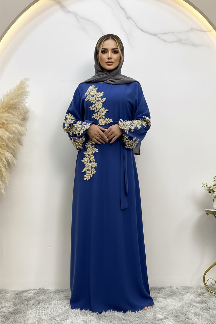 Blue dress with gold embroidery on a white background