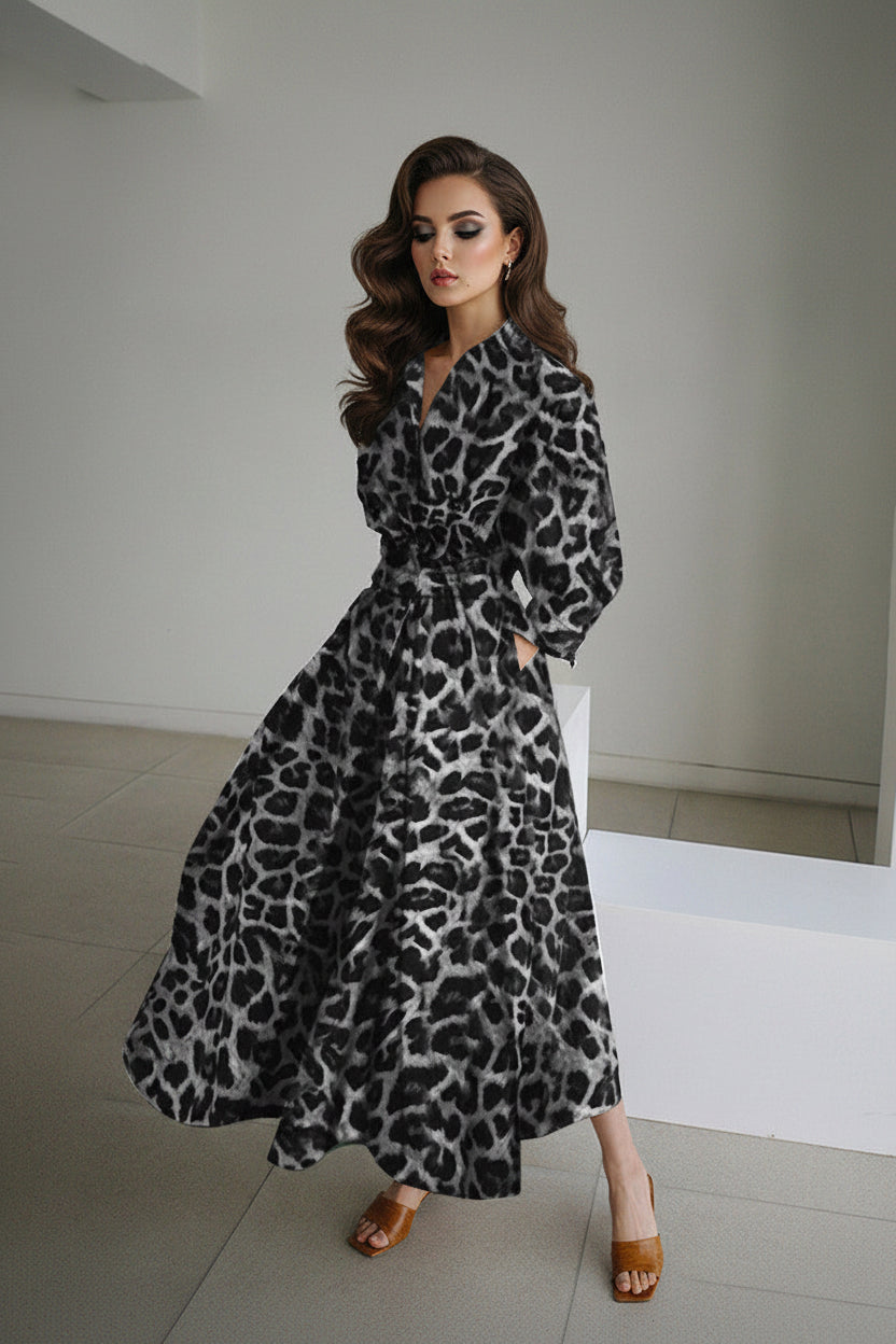 Woman wearing a leopard print dress in an indoor setting