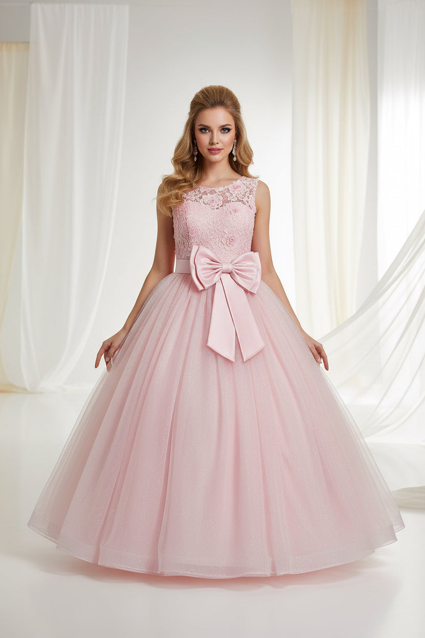 Pink dress with floral top and large bow on a white background