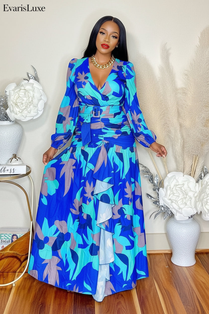 Woman wearing a blue floral dress in a room with decorative elements.