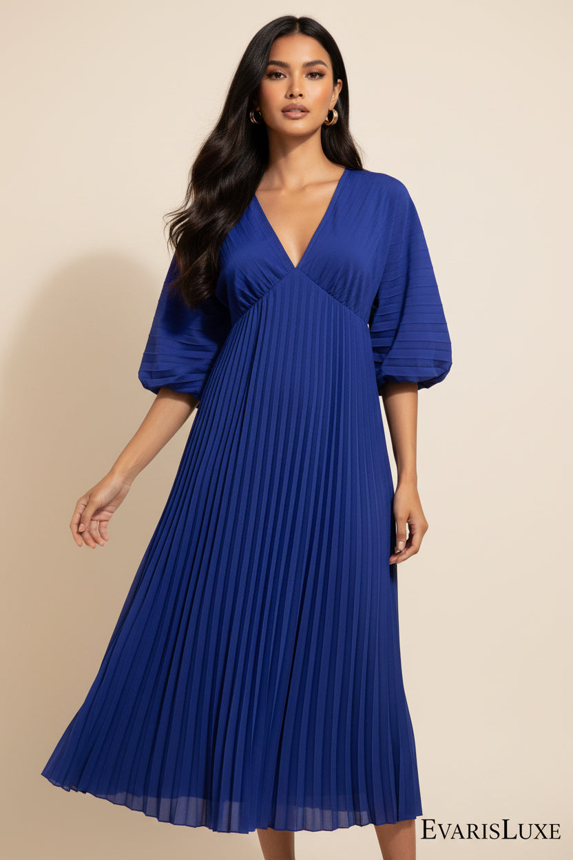 Blue pleated dress on a white background