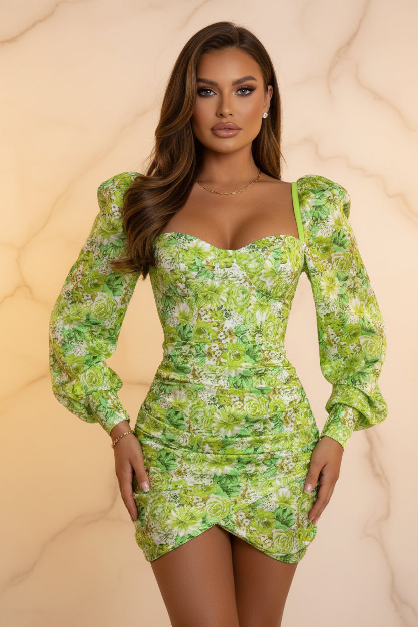 Green floral dress worn by a model against a white wall
