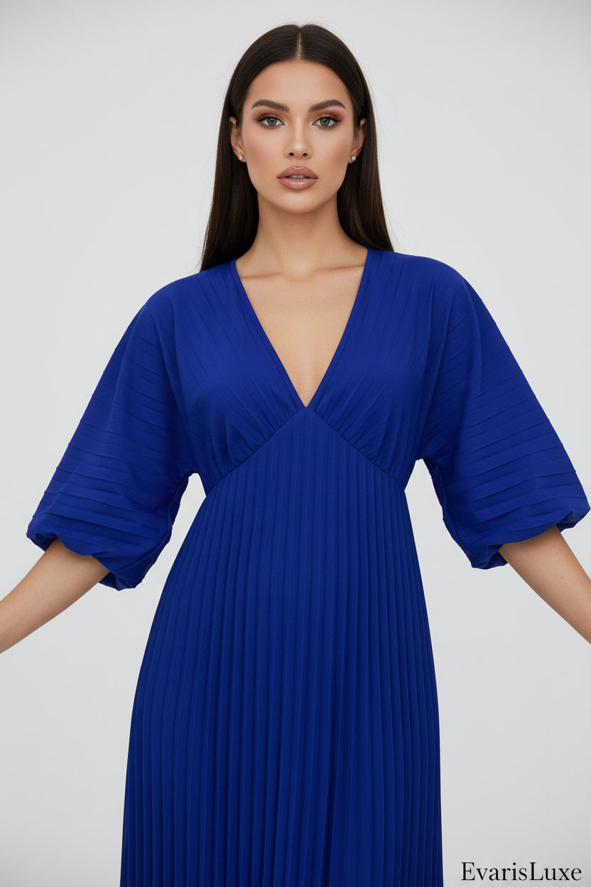 Blue pleated dress on a white background