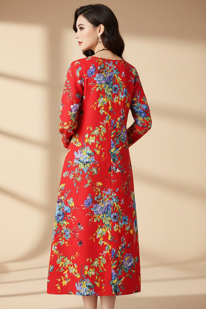Red floral dress worn by a person on a plain background