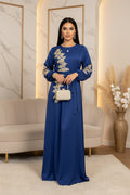 Blue dress with gold embroidery on a white background