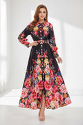 Floral dress on a hanger with flowers and a hat in the background
