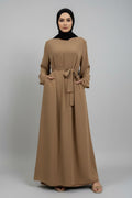 Brown long dress with a belt on a white background