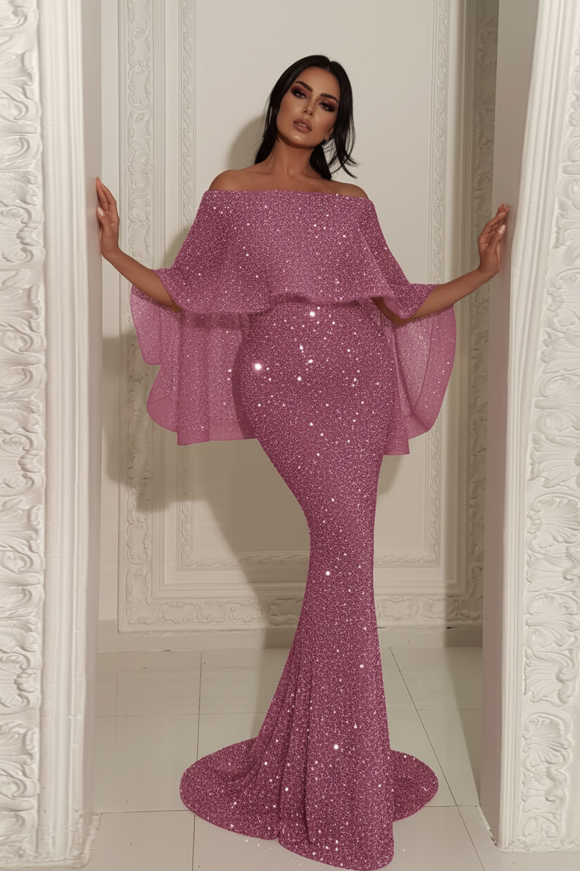 Woman wearing a pink off-shoulder dress with ruffled sleeves in a decorative room.