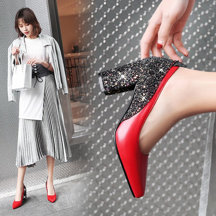 Woman wearing red high-heeled shoes with sparkling embellishments, standing against a patterned background.