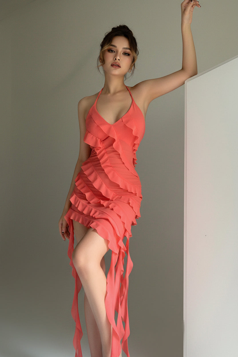 Red ruffled dress worn by a model against a neutral background