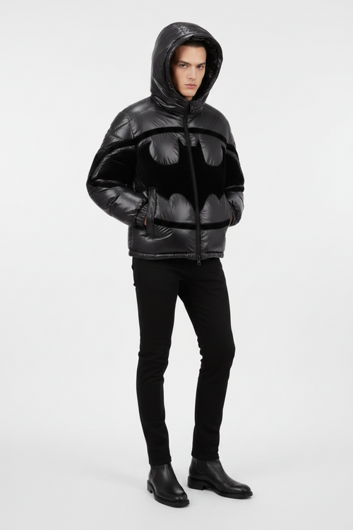 Black puffer jacket with Batman logo design on a light gray background