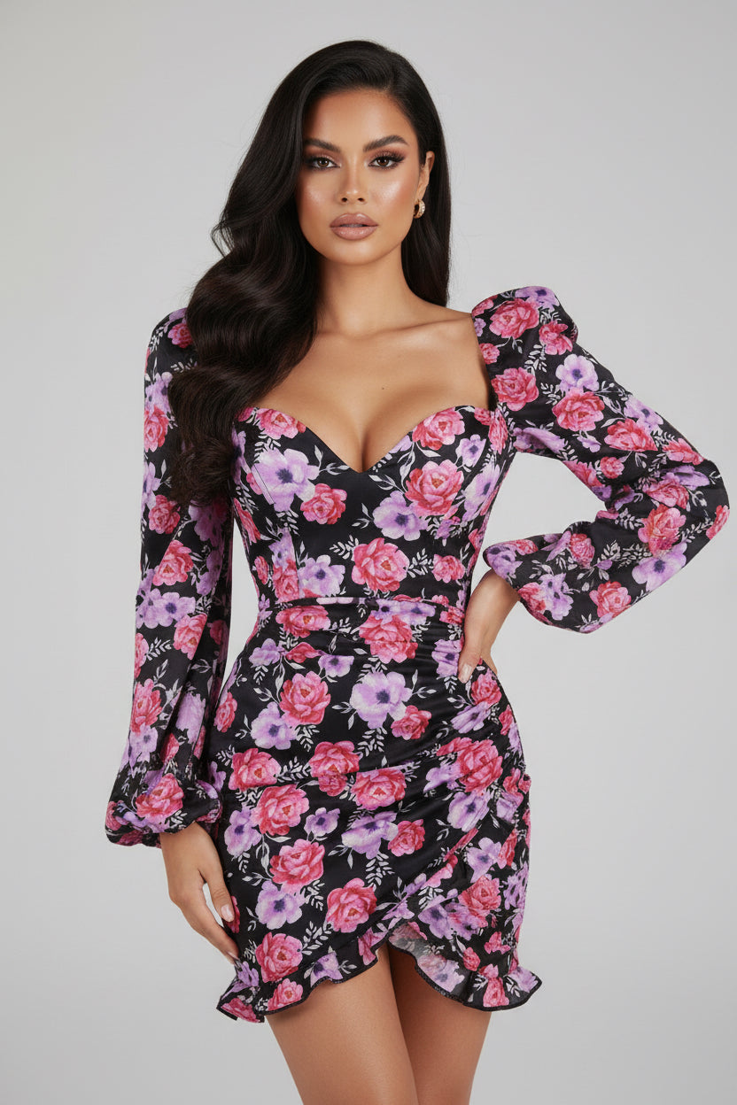 Floral dress with long sleeves and a deep neckline on a white background