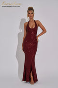 Woman wearing a burgundy sequin dress on a white background