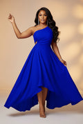 Woman wearing a blue one-shoulder dress on a white background