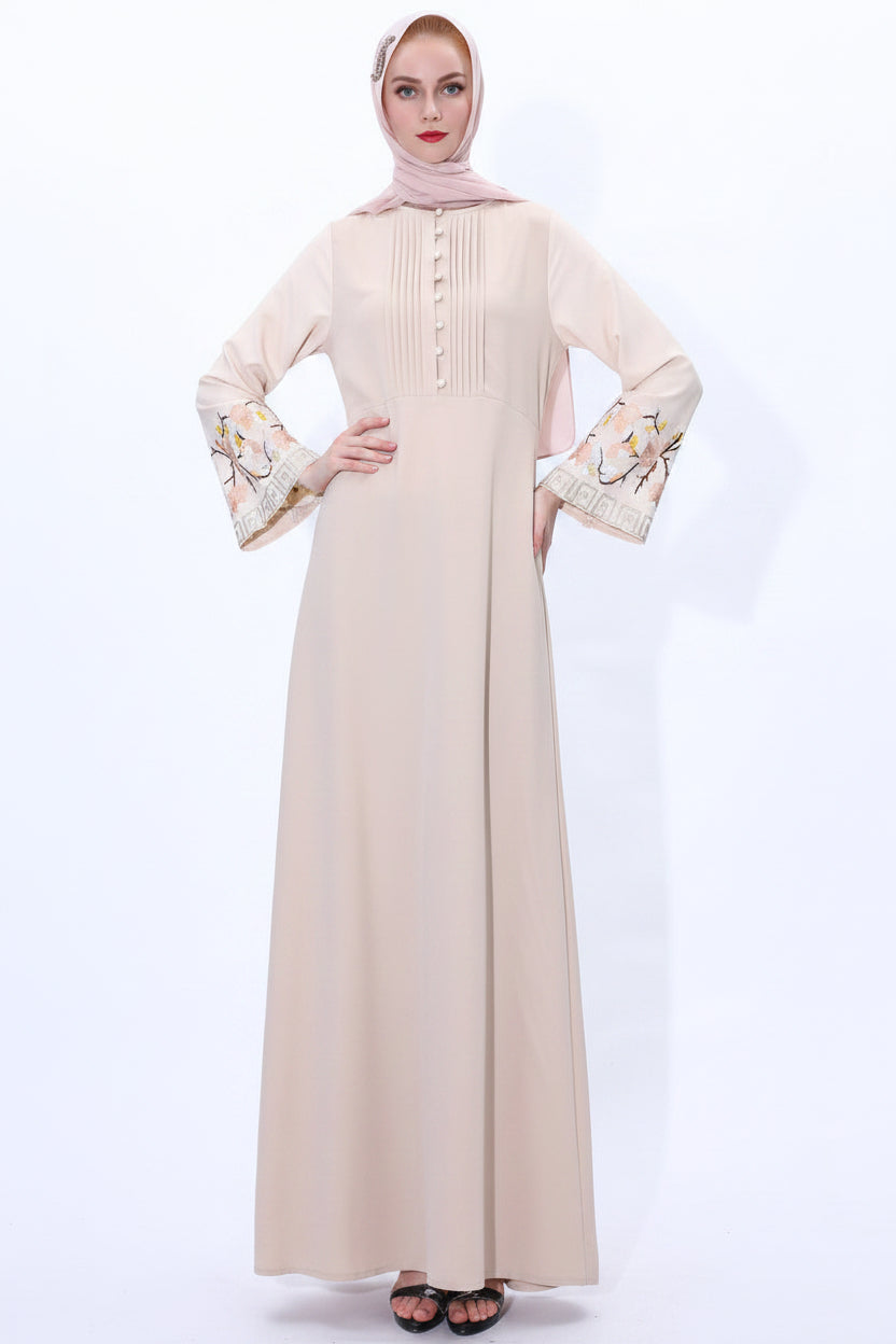 Beige abaya with floral cuffs on a white background