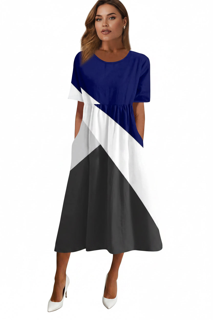 Color-blocked dress with blue, white, and black sections on a white background