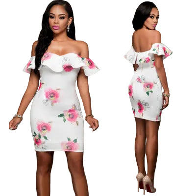 Woman wearing a white floral off-shoulder dress on a gray background