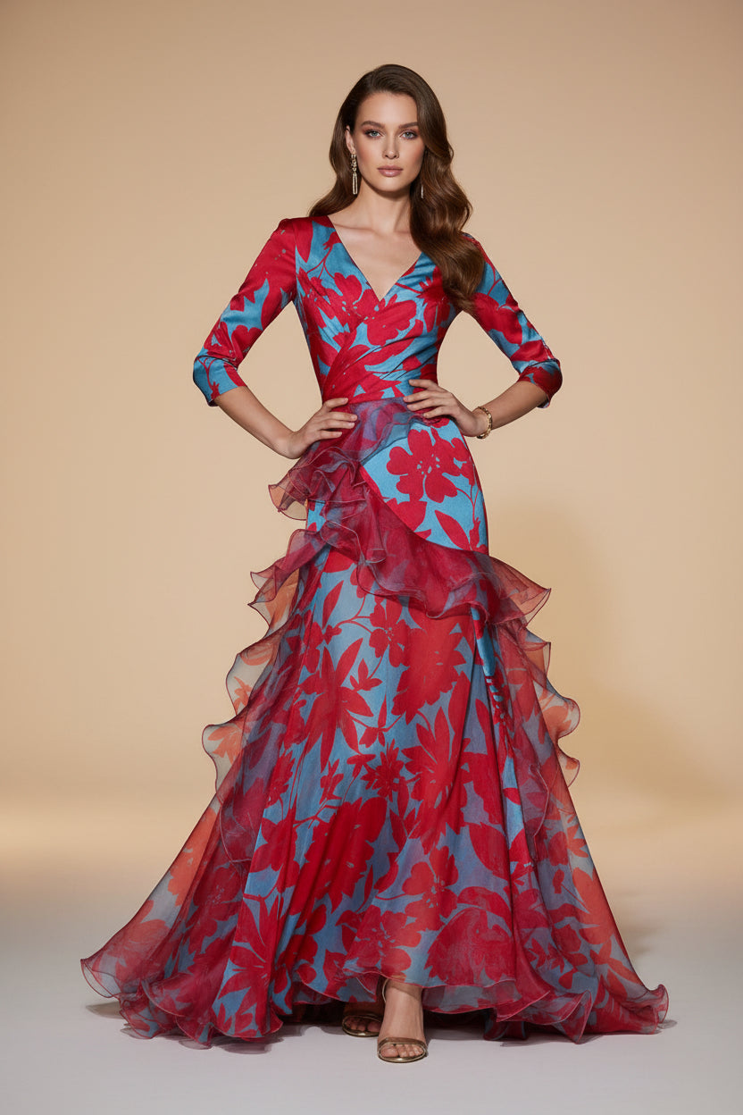 Woman wearing a vibrant floral dress on a dark background