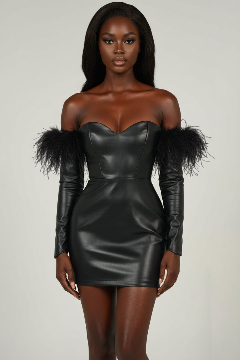 Black leather dress with feathered shoulders on a plain background