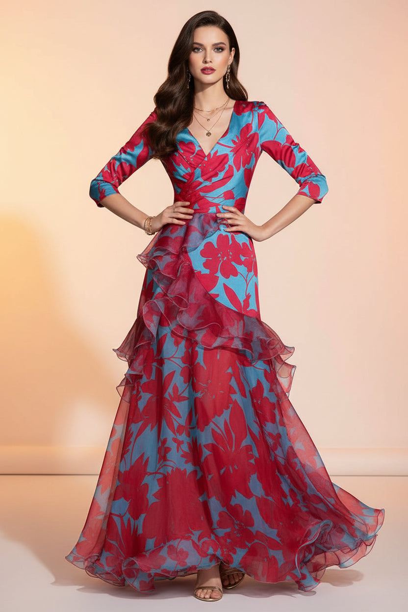 Woman wearing a vibrant floral dress on a dark background