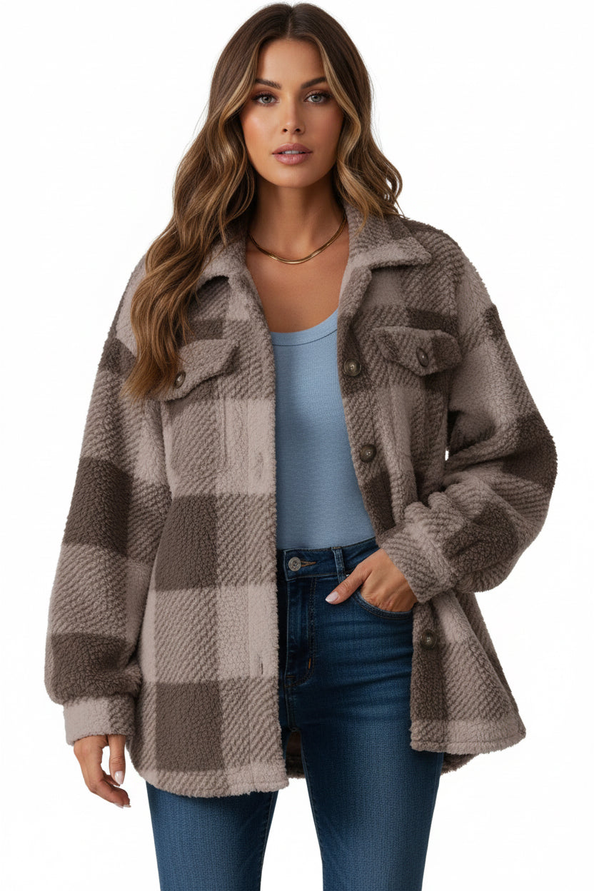 Plaid patterned cardigan worn by a person on a white background