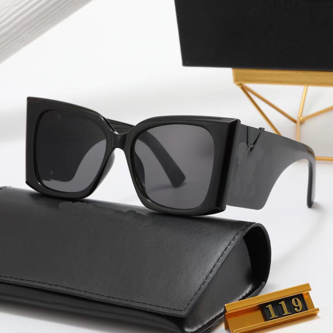 Black sunglasses with a black case on a white background