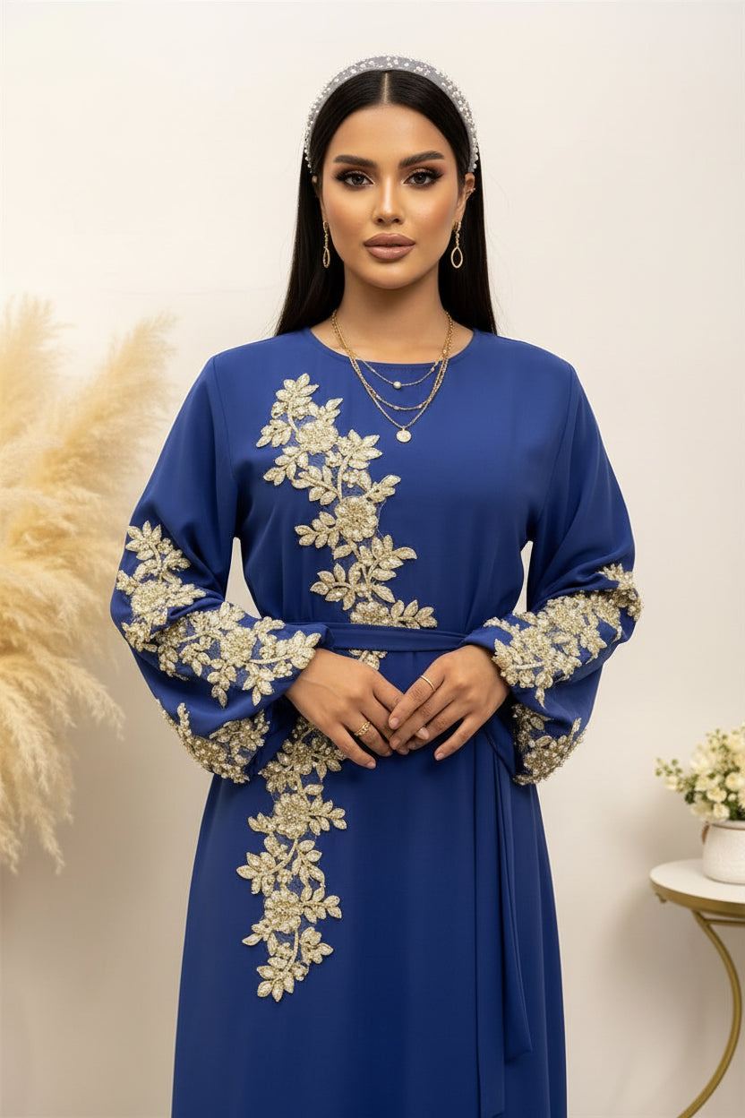 Blue dress with gold embroidery on a white background