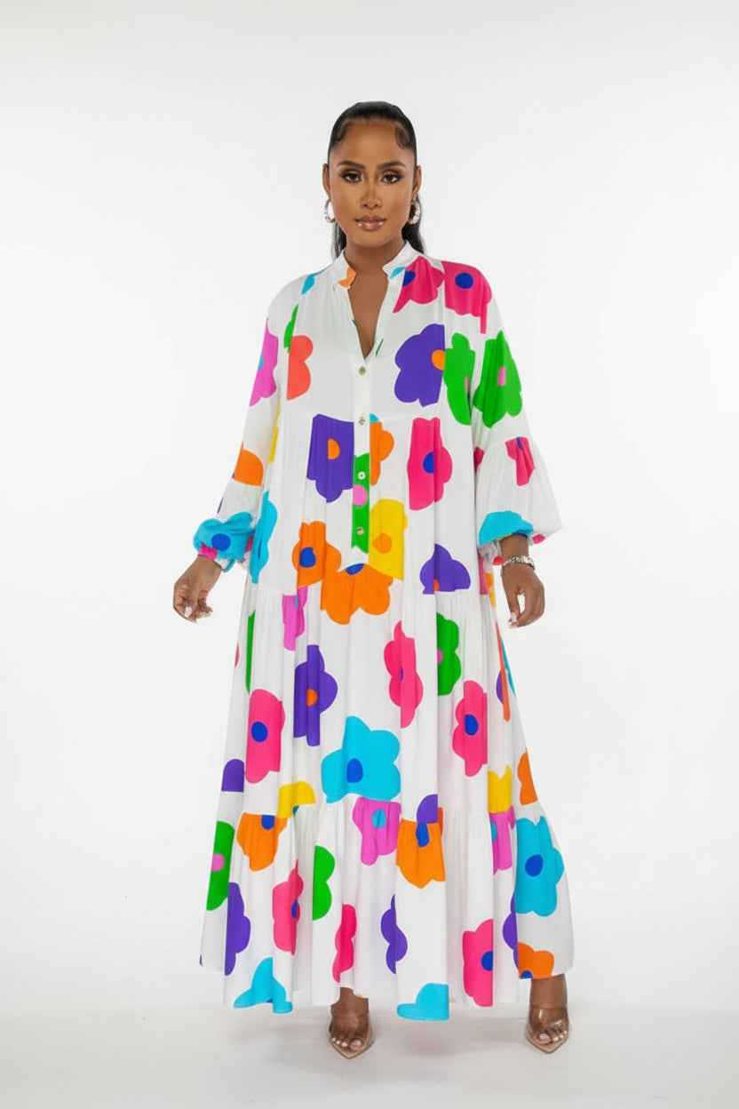 Three women wearing colorful floral dresses on a white background