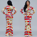 Woman wearing a red, white, and gold patterned dress with a reflective surface.